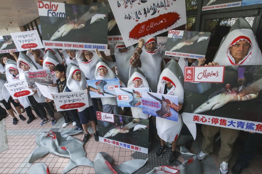 WildAid activists outside Maxim's restaurant at the University of Hong Kong in Pok Fu Lam. Photo: Edward Wong
