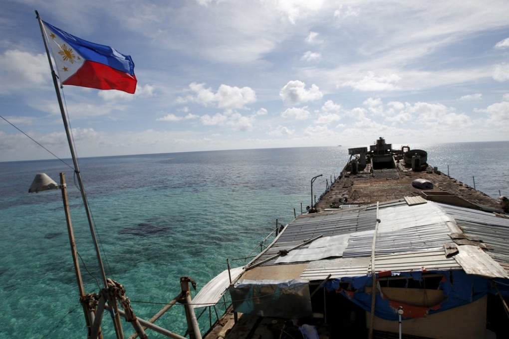 A Philippine flag flying from BRP Sierra Madre, a dilapidated Philippine Navy ship that has been aground since 1999 on the disputed Second Thomas Shoal, part of the Spratly Islands. Photo: Reuters