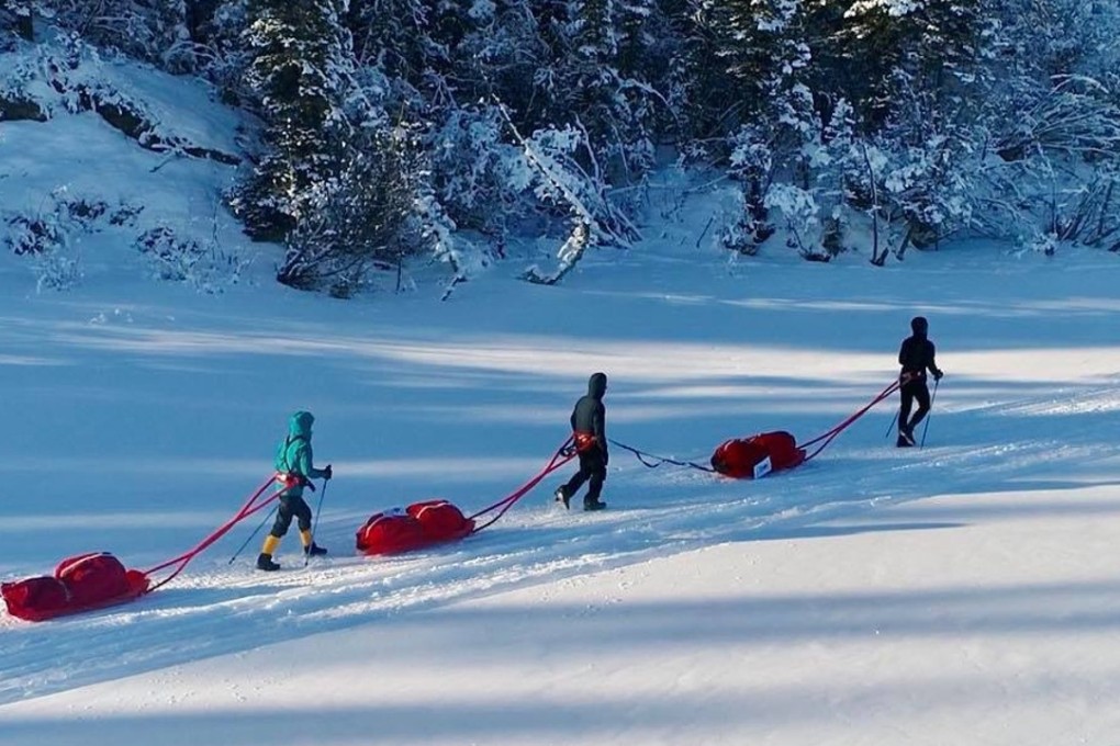 Steve Lo, Gary Leung and Inez Leong drag their sleds across the Yukon. Photo: Handout