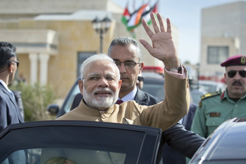 Indian Prime Minister Narendra Modi waves to journalists upon arrival for a meeting with Palestinian President Mahmoud Abbas. Photo: AP