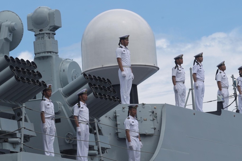 Chinese sailors stand at attention on board a Chinese naval ship during a visit to Davao city, southern Philippines. Photo: Reuters