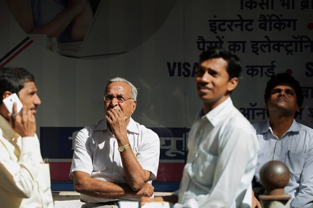 Indian traders watch share prices at the Bombay Stock Exchange. Photo: AFP