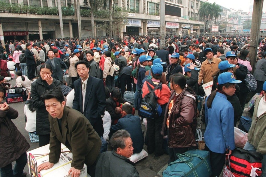 Migrant workers at a train station in Guangzhou. File photo