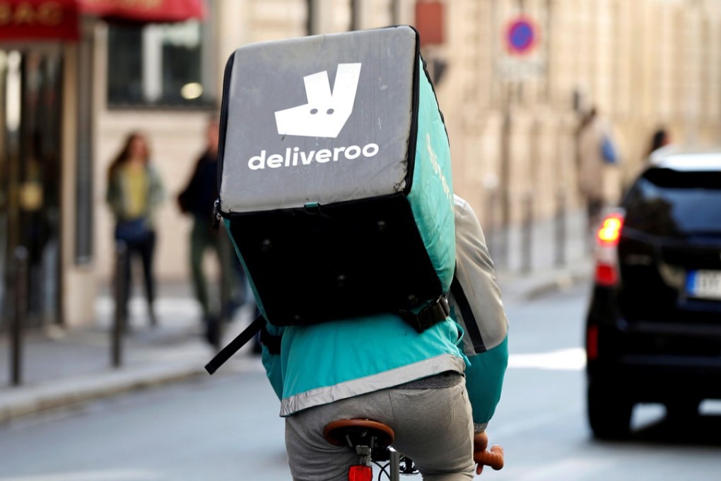 A Deliveroo courier cycling through the streets of Paris. Photo: Reuters