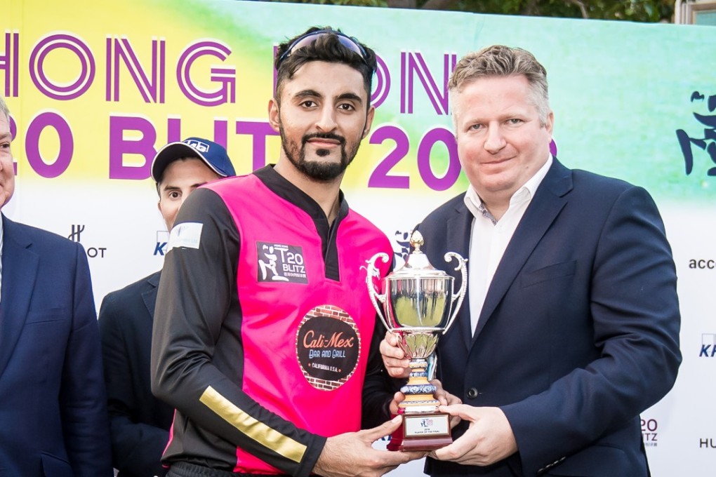 Nizakat Khan receives his man of the match award from CHK director Jonathan Cummings. Photo: Ike Li/Ike Images