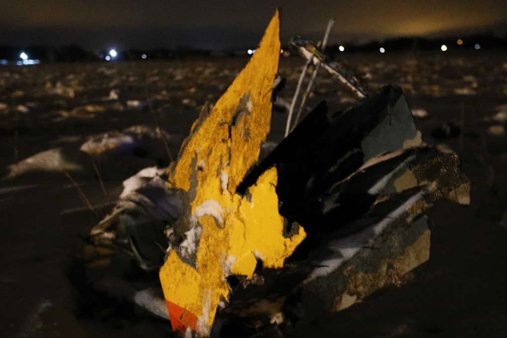 Debris from a Saratov Airlines Antonov AN-148 plane that crashed after taking off from Moscow's Domodedovo airport, is seen at the scene of the incident. Photo: Reuters