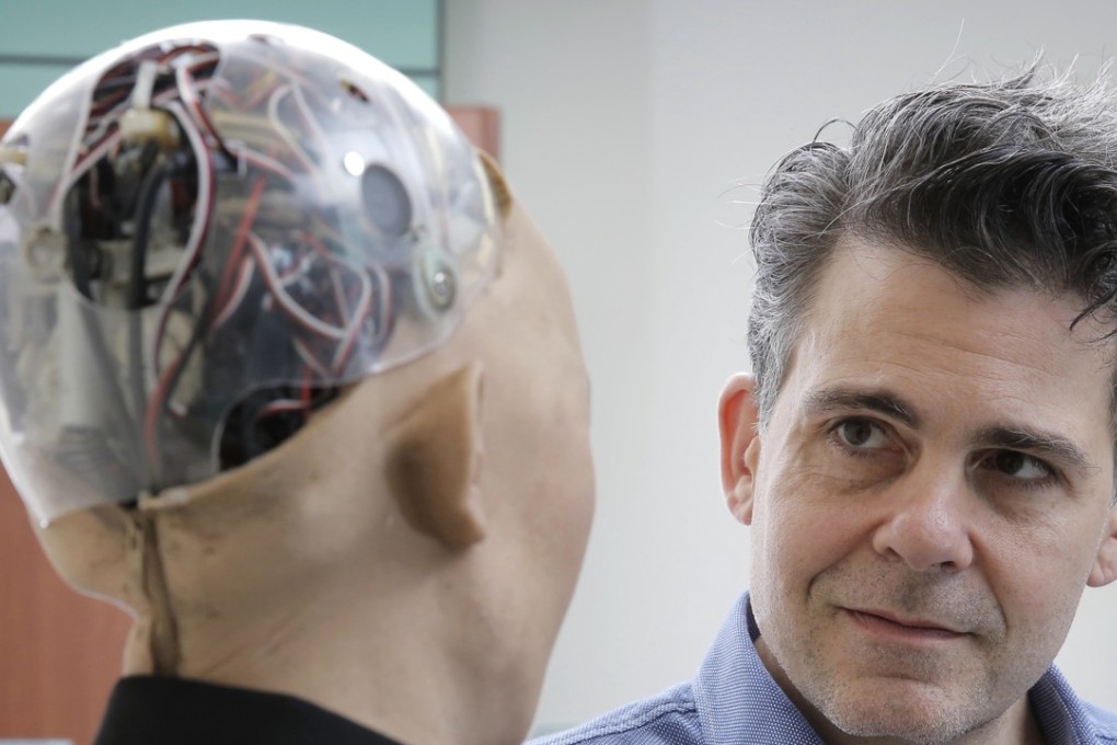 David Hanson, the founder of Hanson Robotics, talks with his company's flagship robot Sophia powered by artificial intelligence in Hong Kong. Hanson envisions a future in which AI-powered robots evolve to become “super-intelligent genius machines” that can help solve mankind’s most challenging problems. Photo: AP