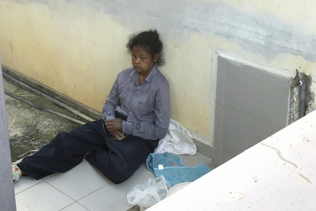 Indonesian maid Adelina Lisao sits on the porch in Bukit Mertajam, near Penang, Malaysia. Photo: AP