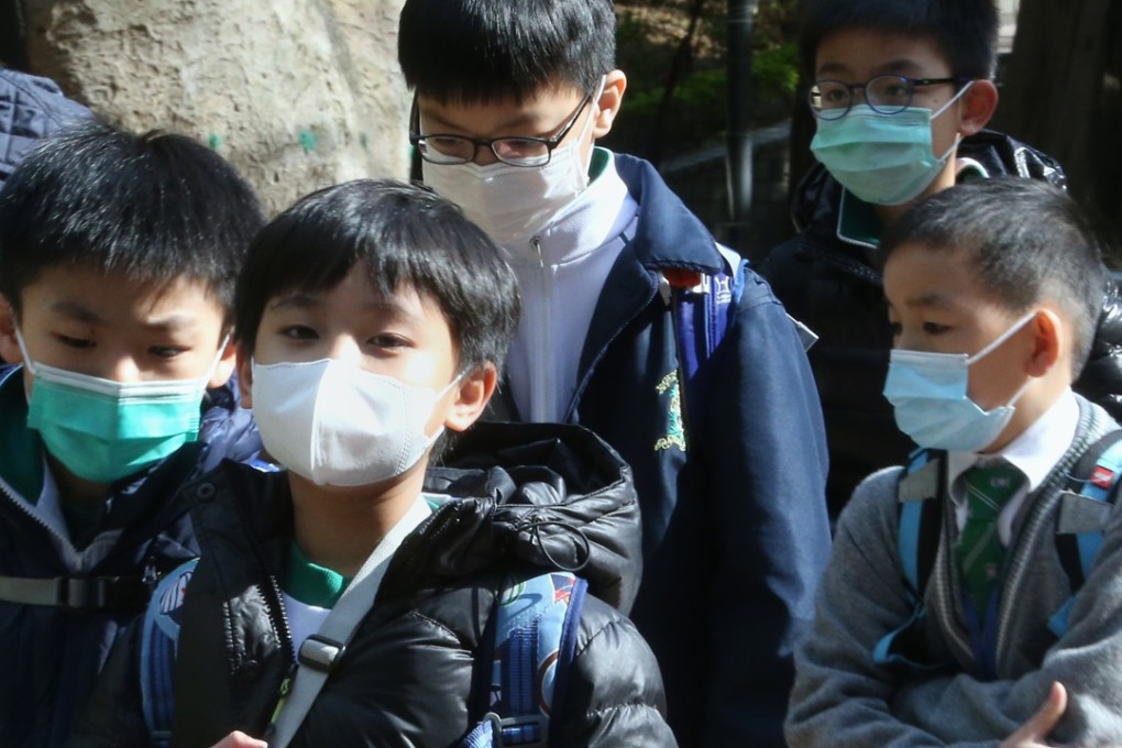 Children wearing masks in Wan Chai last week. Photo: David Wong