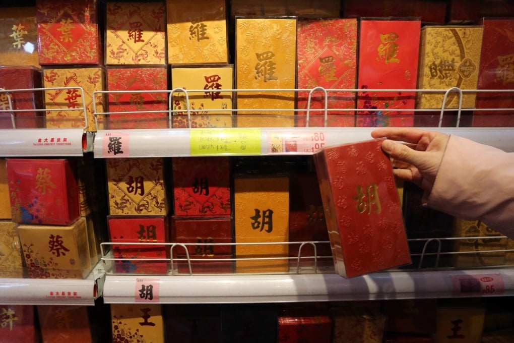 A consumer picking Lunar New Year red packet envelopes in Hong Kong. Photo: Felix Wong