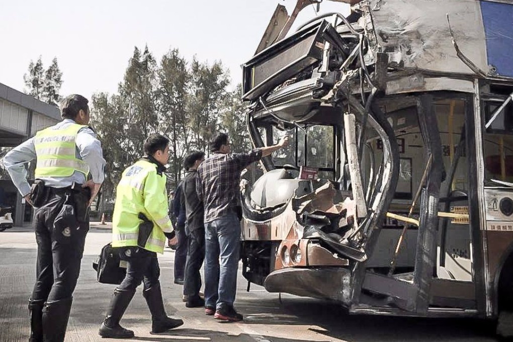Police officers inspect the mangled bus involved in Saturday’s deadly Tai Po bus crash. Photo: Facebook