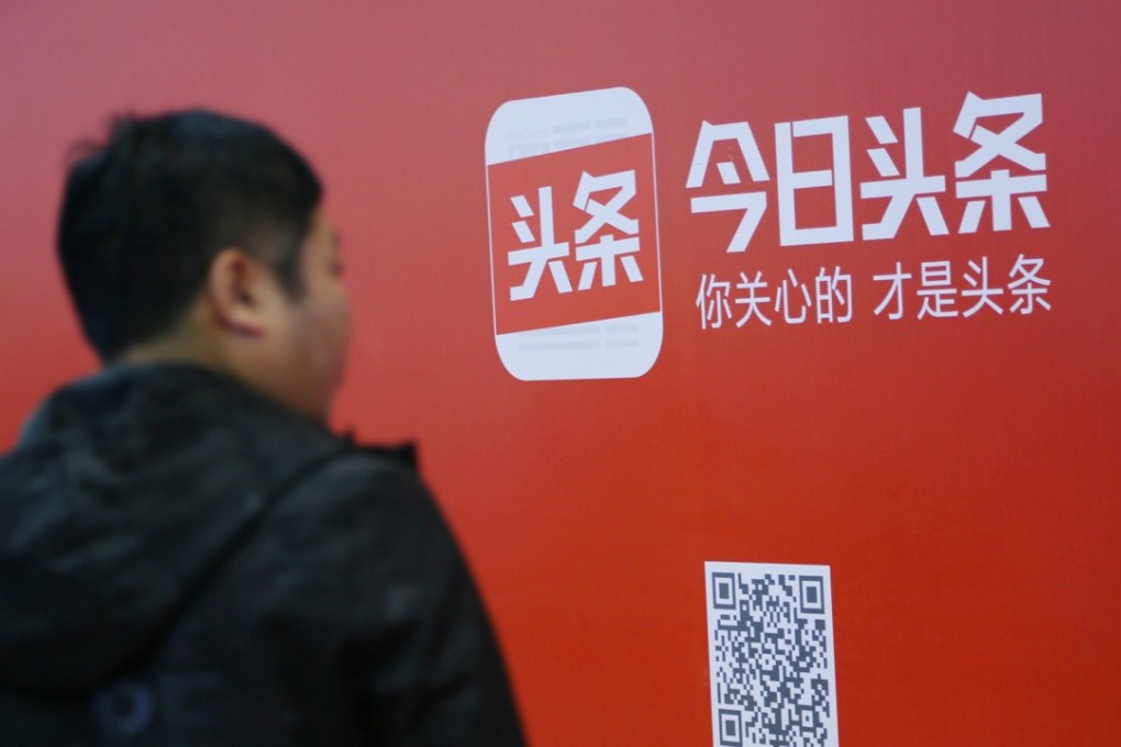 A man walks past an sign for news feed platform Toutiao in Beijing. The site’s missing person alert project helped locate 3,573 people last year. Photo: Reuters