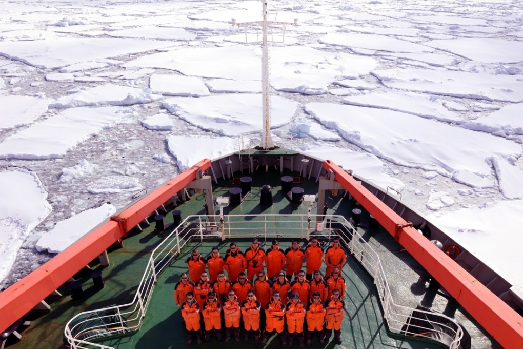 Members of China's 34th Antarctic expedition pose on the deck of China's research icebreaker Xue Long (Snow Dragon) on January 15. The ship has also been used to make voyages to the Arctic. Photo: Xinhua