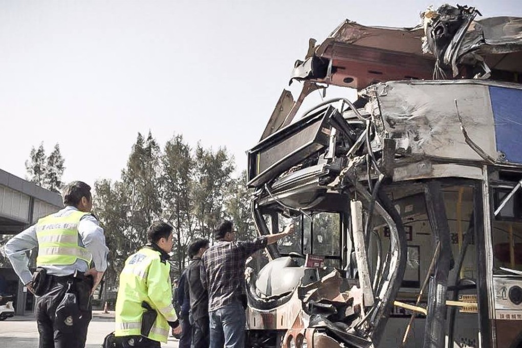 Police officers inspected the KMB double decker involved in the Tai Po fatal bus crash, the inspection was carried out at the Police Vehicle Examination Centre in Tai Lam Chung. Photo: Facebook