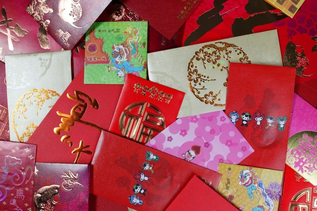 Exchanging red envelopes filled with cash is traditional over the Lunar New Year holiday in China. Photo: SCMP File