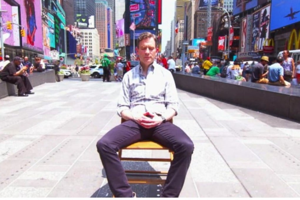 Dan Harris, author of 10% Happier and Meditation for Fidgety Skeptics: A 10% Happier How-to Book, meditating in the street.