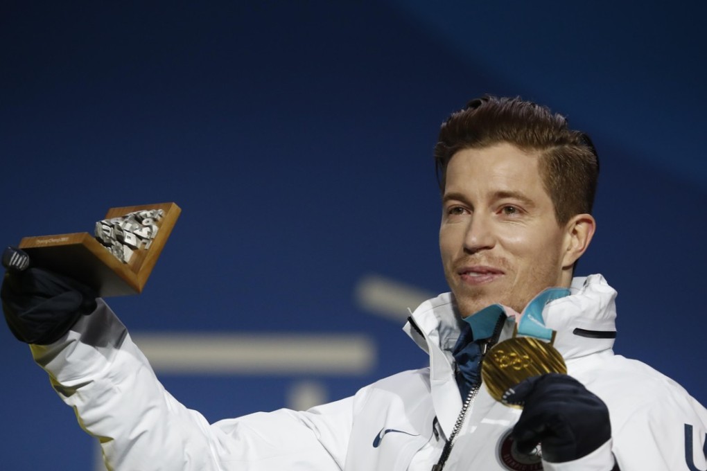 Shaun White shows off his gold medal. Photo: Reuters