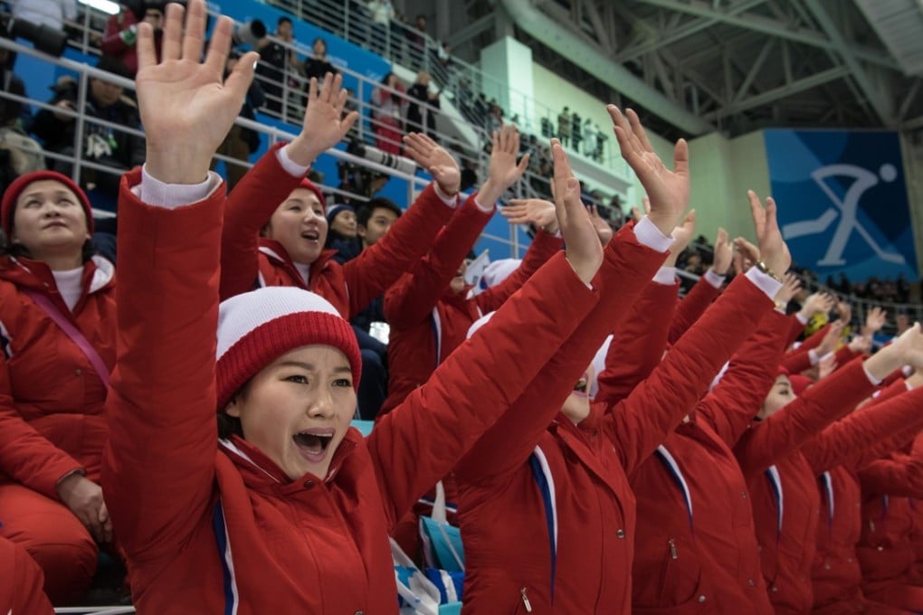 North Korean cheerleaders perform during the women's preliminary round ice hockey match between the unified Korea team and Switzerland at the Pyeongchang 2018 Winter Olympics on February 10. Photo: AFP