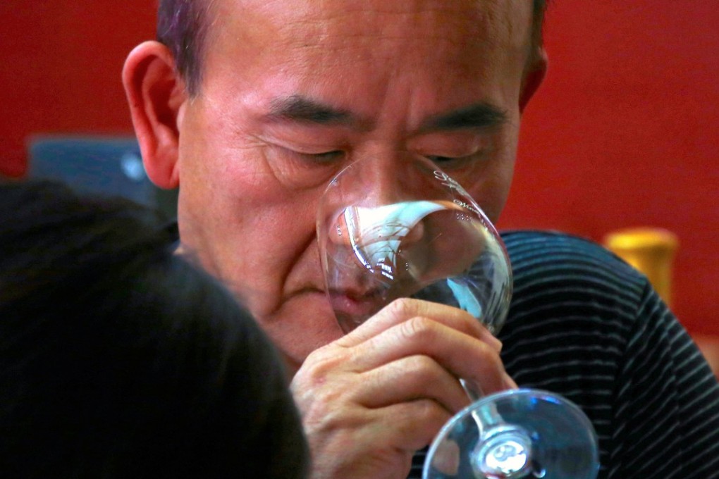 A Chinese man drinks wine during a tasting at Peterson’s Winery in the Hunter Valley, north of Sydney in Australia. Photo: Reuters