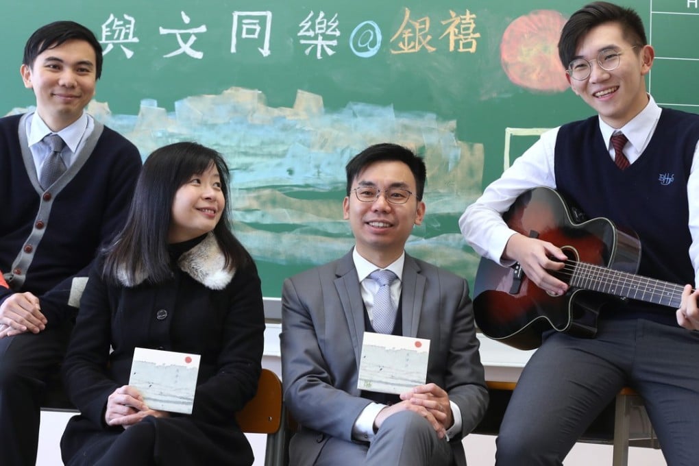 Looking on are (left to right) Chinese teacher Chan Yik-yeung and principal Wong Lee-lee of Bishop Hall Jubilee School, as vice-principal Kwan Chi-kuen and student musician Wan Tsz-kin talk about their musical study guides, in Kowloon Tsai on February 8. Photo: Winson Wong