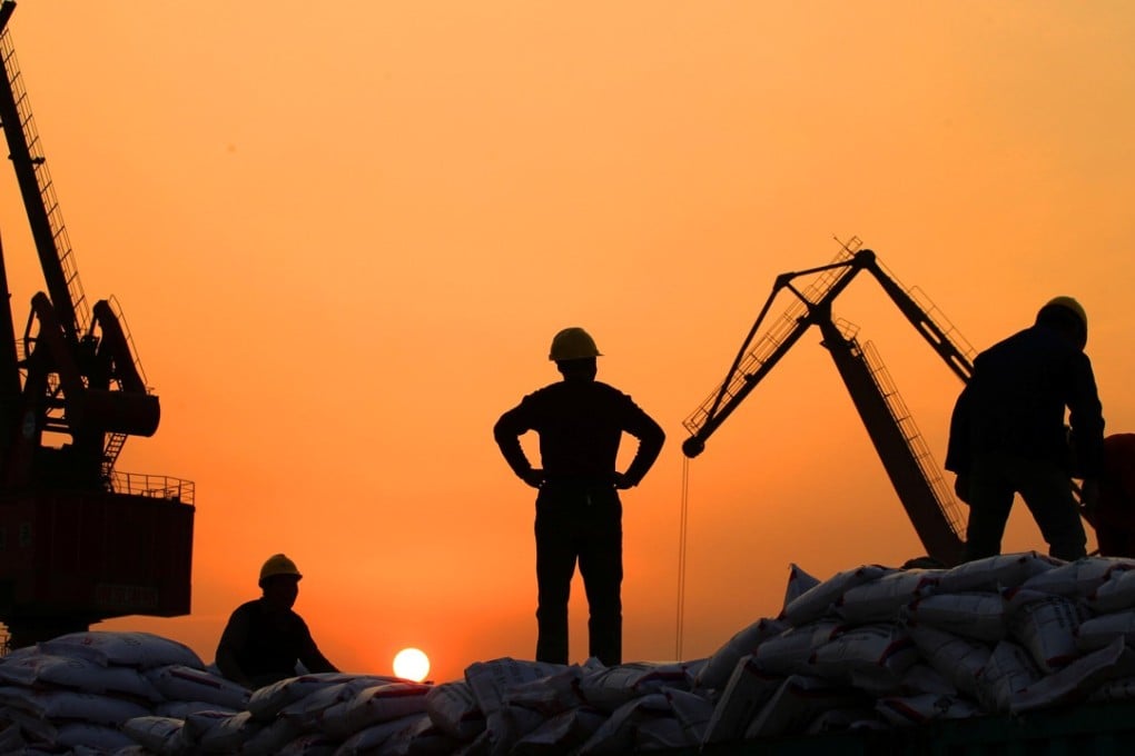 Workers load imported goods at a port in Nantong, Jiangsu province, China. Ambitious businesses and leaders in the region are busy formulating strategic plans to be involved in the ‘Belt and Road Initiative’, which will involve people in more than 70 countries around the world.