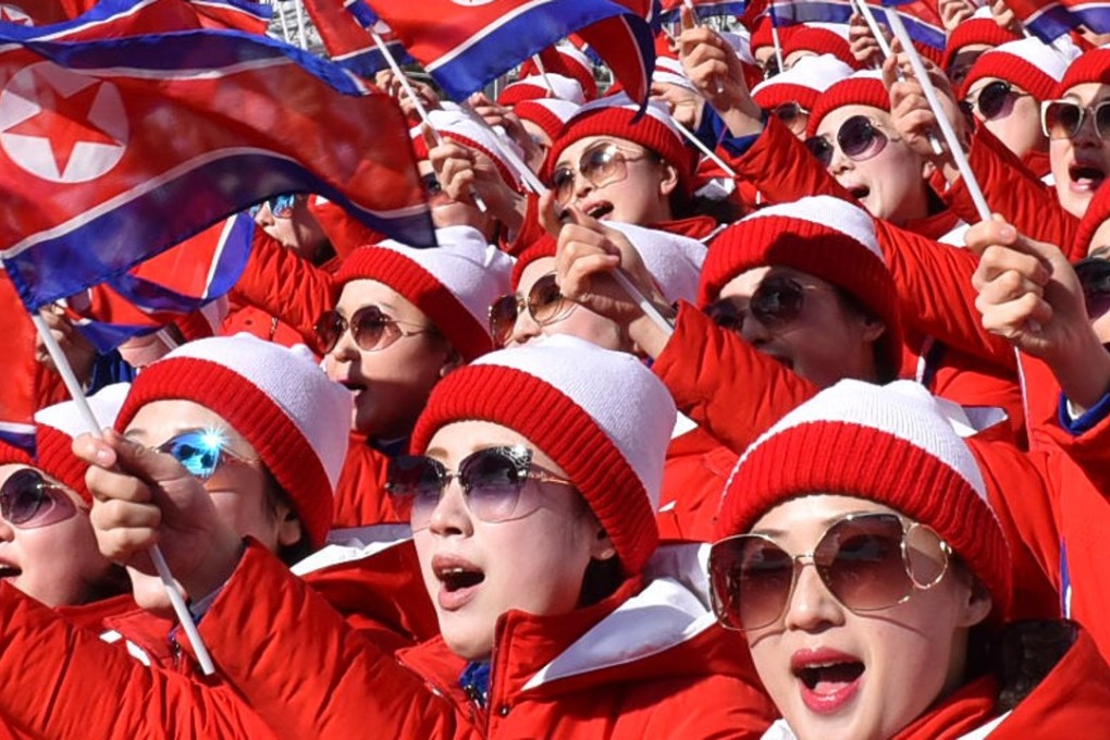 North Korean cheerleaders wearing sunglasses during the women's alpine skiing giant slalom competition. Photo: Kyodo