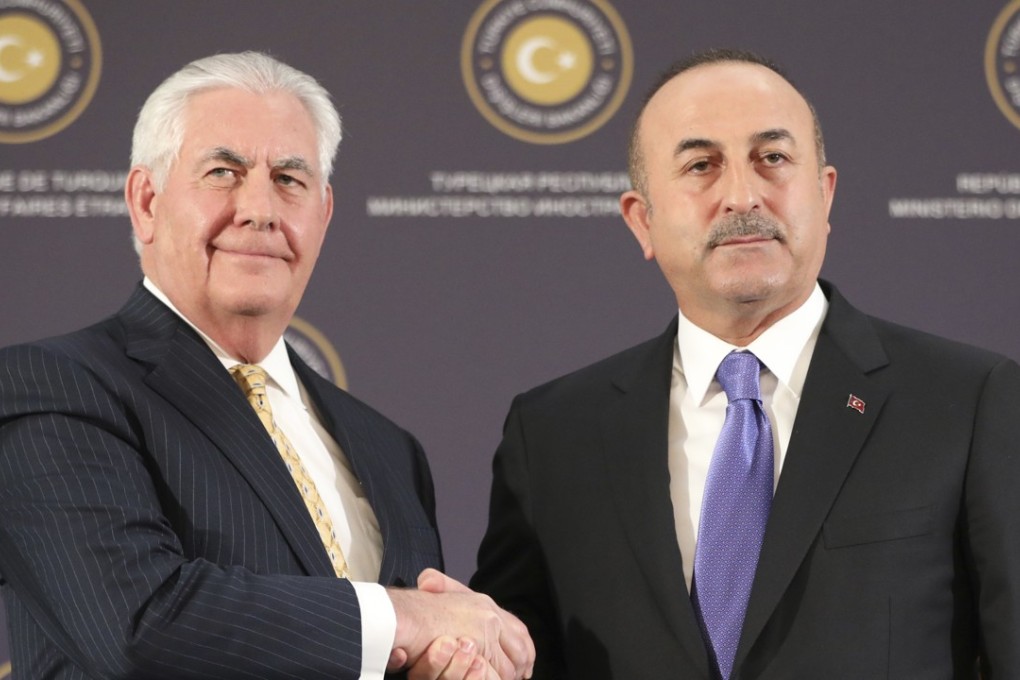 US Secretary of State Rex Tillerson shakes hands with Turkey's Foreign Minister Mevlut Cavusoglu. Photo: AP