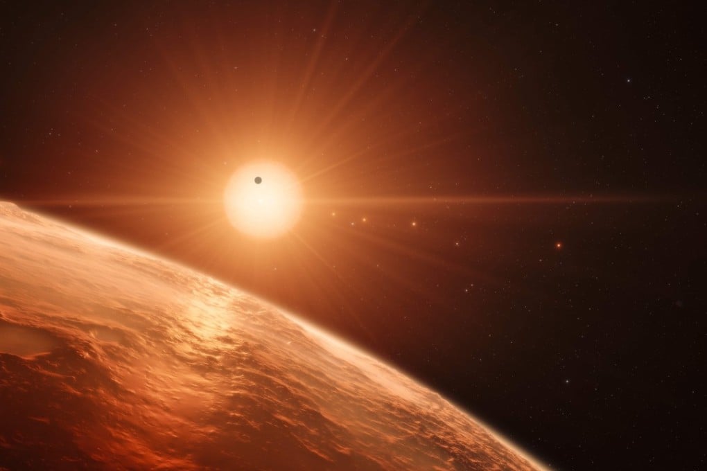 This handout image obtained from the European Southern Observatory (ESO) shows an artist’s impression showing the view from the surface of one of the planets in the TRAPPIST-1 system. Photo: AFP