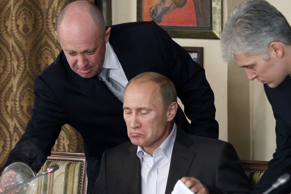 Restaurateur and businessman Yevgeny Prigozhin serves food to Russian prime minister at the time, Vladimir Putin. Photo: AP