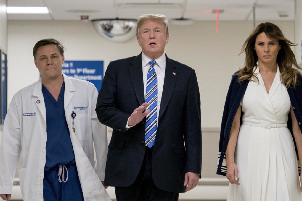 President Donald Trump and first lady Melania Trump visit medical staff at a hospital in Pompano Beach, Florida after Wednesday’s shooting. Photo: AP