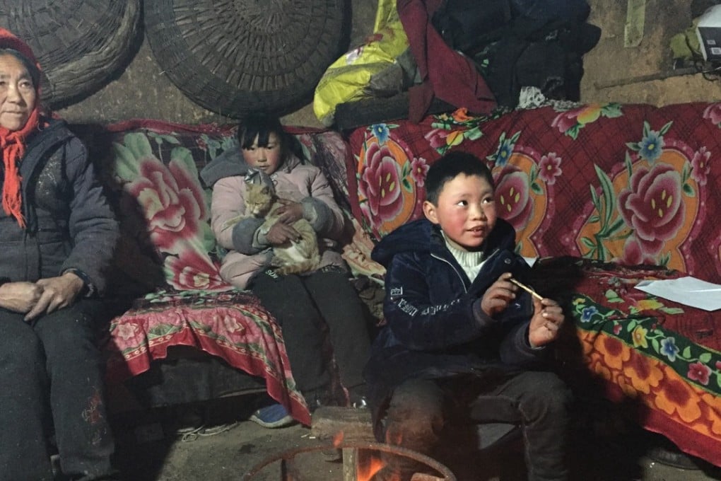 Wang Fuman (right), sister Wang Fumei and their grandmother, Yao Chaozhi, at home in Zhuanshanbao village, Ludian county, Yunnan. Photo: Alice Yan