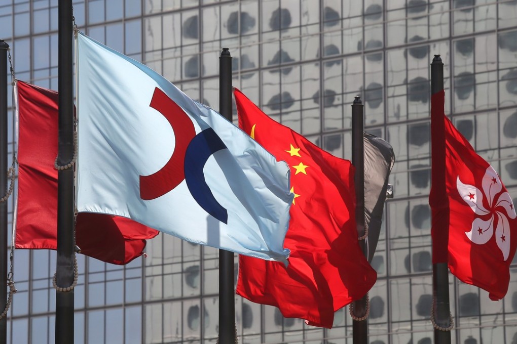 The Hong Kong Stock Exchange flag, China flag and Hong Kong flag are seen outside of the Hong Kong Stock Exchange in Central. 18JAN18 SCMP / Dickson Lee