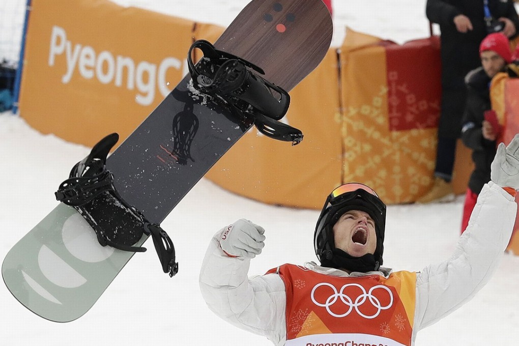 Shaun White, of the United States, celebrates winning gold after his run during the half-pipe finals. Photo: AP