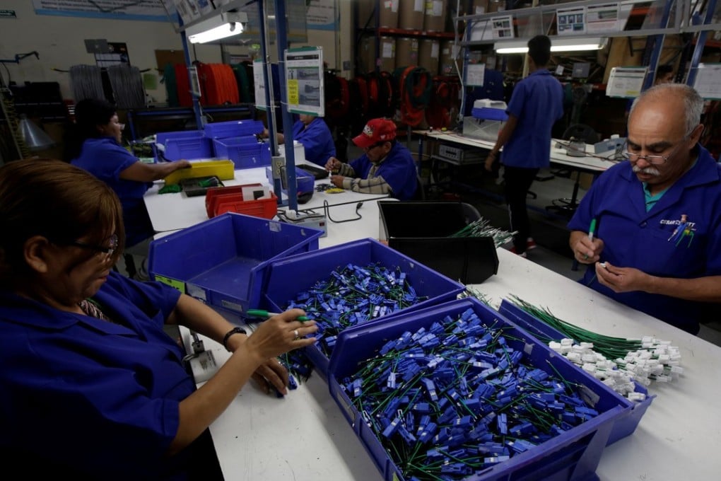 Jobs like this at an assembly plant in Mexico may disappear in the coming “post work” world of artificial intelligence, but should all people be paid a standard wage by governments? Photo: Reuters