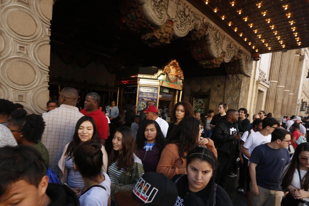 Fans exit the first Saturday screening of Black Panther as others wait to get in for the next performance at a cinema in Hollywood. Photo: Genaro Molina/Los Angeles Times/TNS