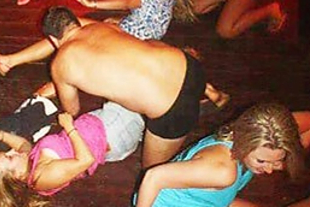 Police released images of the foreigners simulating various sexual positions at a party. Photo: Cambodia National Police