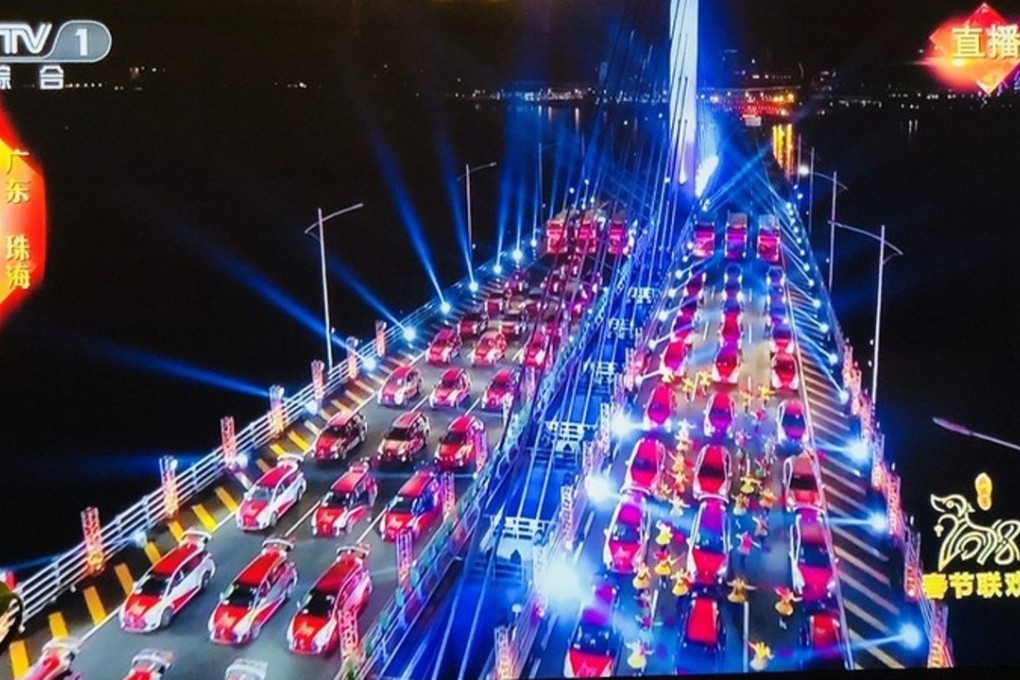 Performers dance around driverless cars lined up on the Hong Kong-Zhuhai-Macau bridge for the Spring Festival Gala. Photo: Handout