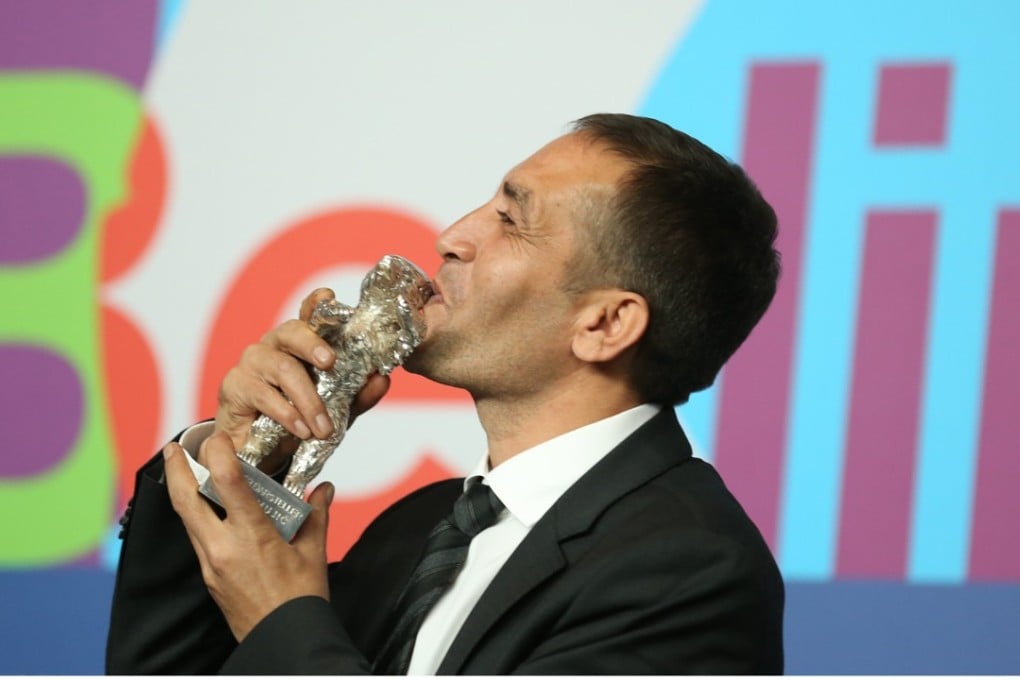 Bosnian actor Nazif Mujic poses with his Silver Bear award for Best Actor at the 63rd annual Berlin International Film Festival, in Berlin, Germany, on February 16, 2013. Photo: EPA