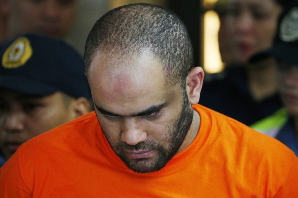 Arrested foreigner Fehmi Lassoued, also known as John Rasheed Lassoned, said to be Egyptian, is presented to the media during a news conference on February 19, 2018 at Camp Crame in Quezon City, Metro Manila, Philippines. Photo: AP