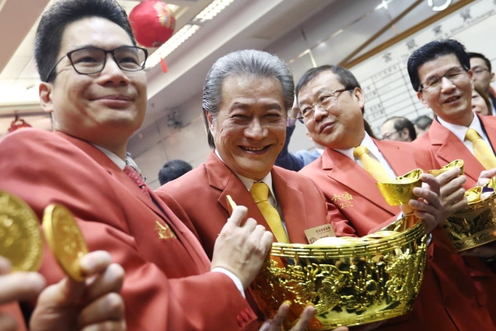 From left, Joseph Chan Ho-lim, Undersecretary for Financial Services and the Treasury and Haywood Cheung Tak-hay, president of the Chinese Gold & Silver Exchange Society, attend the exchange’s trading ceremony in Sheung Wan, on Tuesday. Photo: Nora Tam