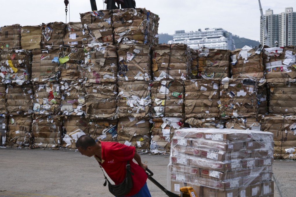 A worker drags piles of waste paper at the public cargo working area in Tsuen Wan. The recycling industry is crucial to Hong Kong but needs to reinvent itself to attract fresh talent. Photo: Sam Tsang