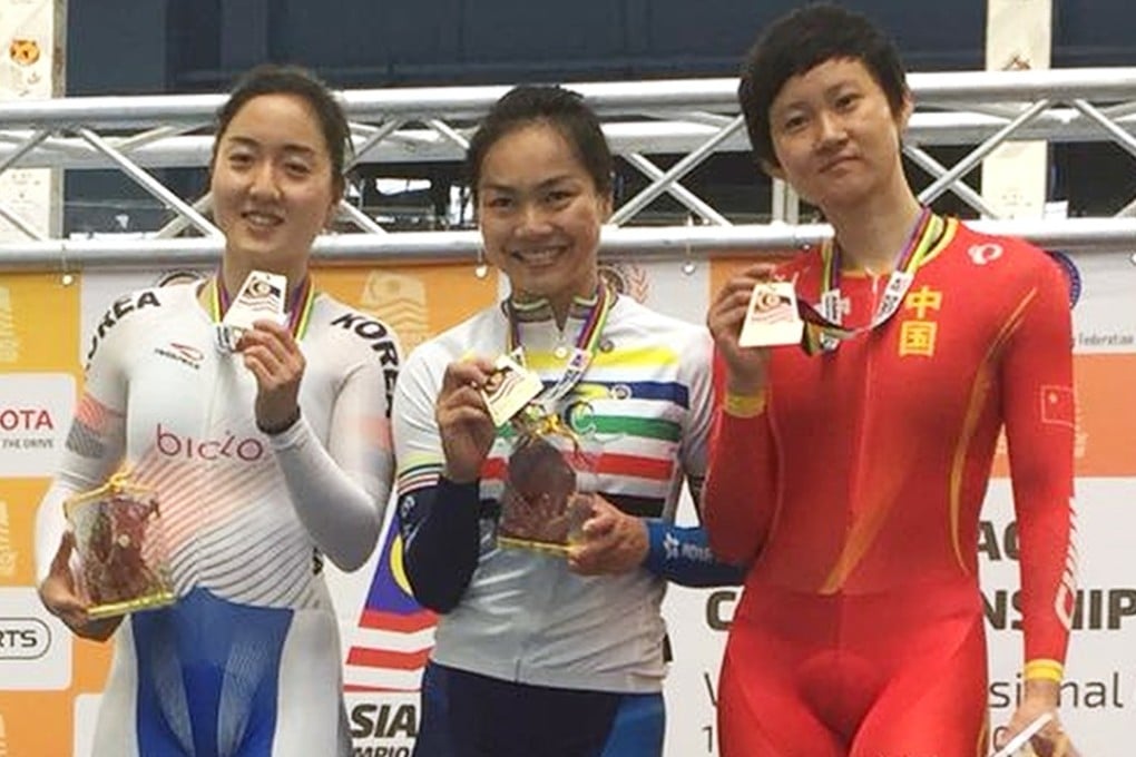 Hong Kong's Sarah Lee (centre) stands proudly on the podium after collecting her third gold in Malaysia. Photos: Handout