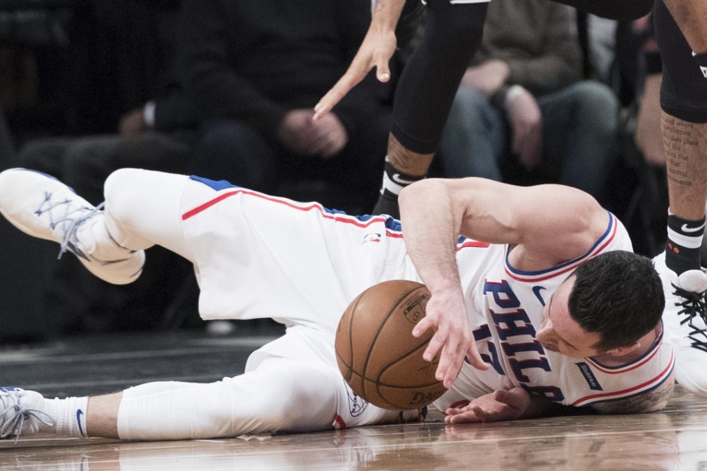 Philadelphia 76ers guard J.J. Redick falls to the floor in a match against the Brooklyn Nets. Photo: AP