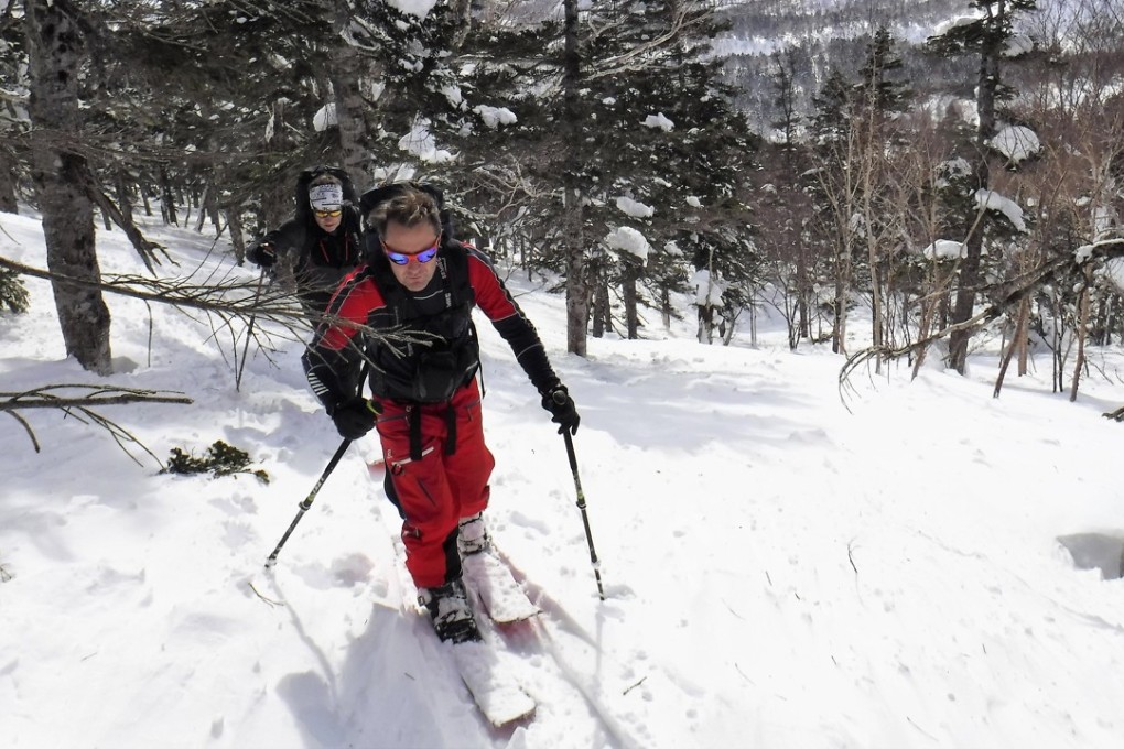 Two ski tourers skin up a mountain in Hakuba, Japan. Photo: Alf Alderson