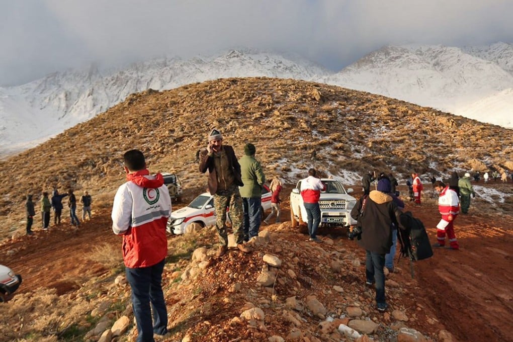 A rescue team searches for the wreckage of Aseman Airlines flight EP3704 in Iran's Zagros mountain range. Photo: Tasnim News via AFP