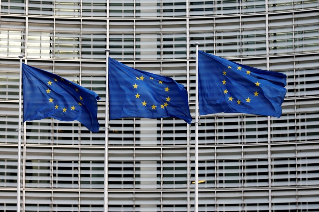 European Union flags outside the EU Commission headquarters in Brussels. Different views on who was to blame for the bloc’s financial troubles are hindering its search for common solution. Photo: Reuters