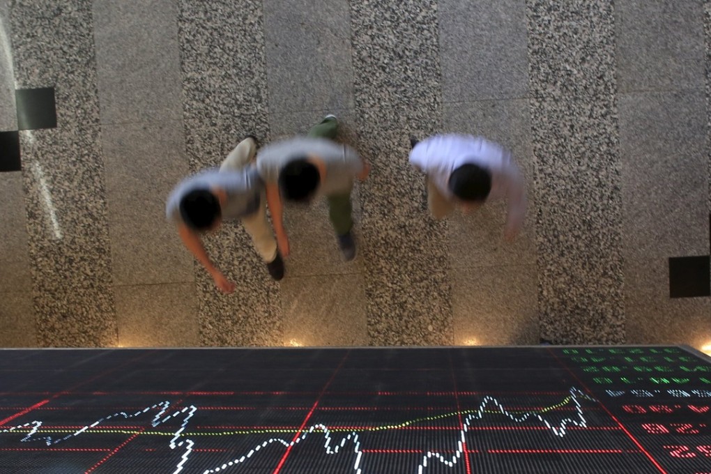 Stock information displayed at the Shanghai Stock Exchange in Lujiazui Financial Area in Shanghai. Photo: Reuters