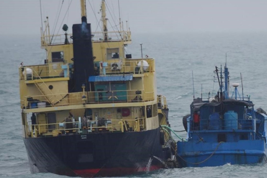 This February 16, 2018 photo released by Japan's Ministry of Defence shows what it says North Korean-flagged tanker Yu Jong 2, left, and Min Ning De You 078 lying alongside in the East China Sea. Photo: AP