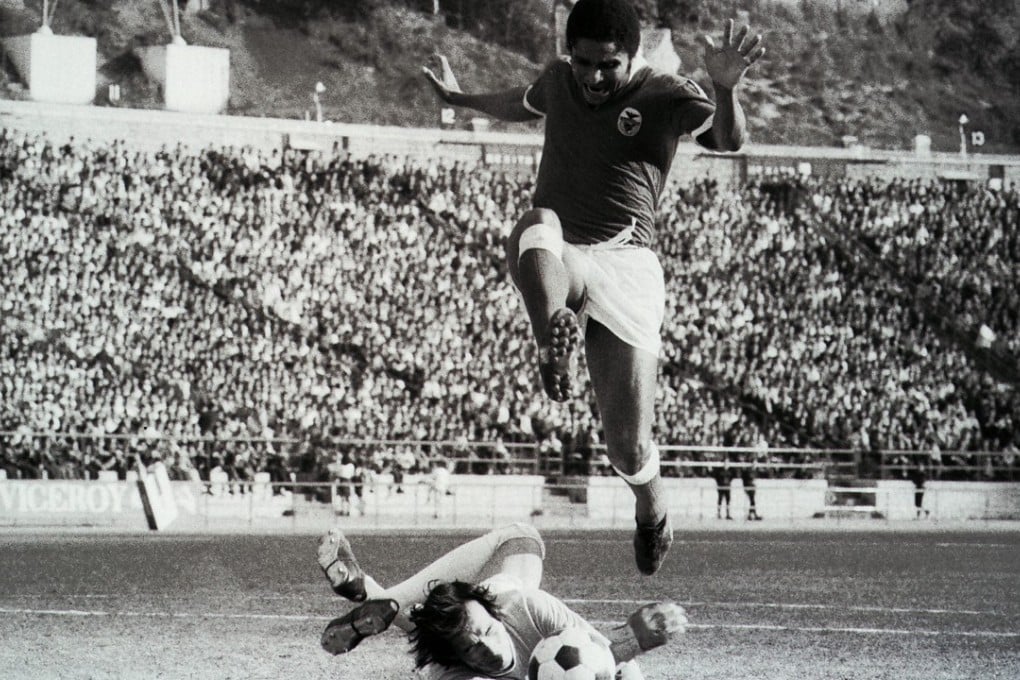 Chow Chee Keong saves from legendary Portuguese Eusebio while playing for an Overseas XI against Benfica at Hong Kong Stadium in February 1973.
