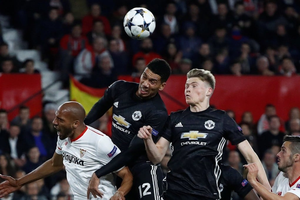 Manchester United’s Chris Smalling and youngster Scott McTominay challenge with Sevilla’s Steven N’Zonzi during the Champions League last-16 match. Photo: Reuters